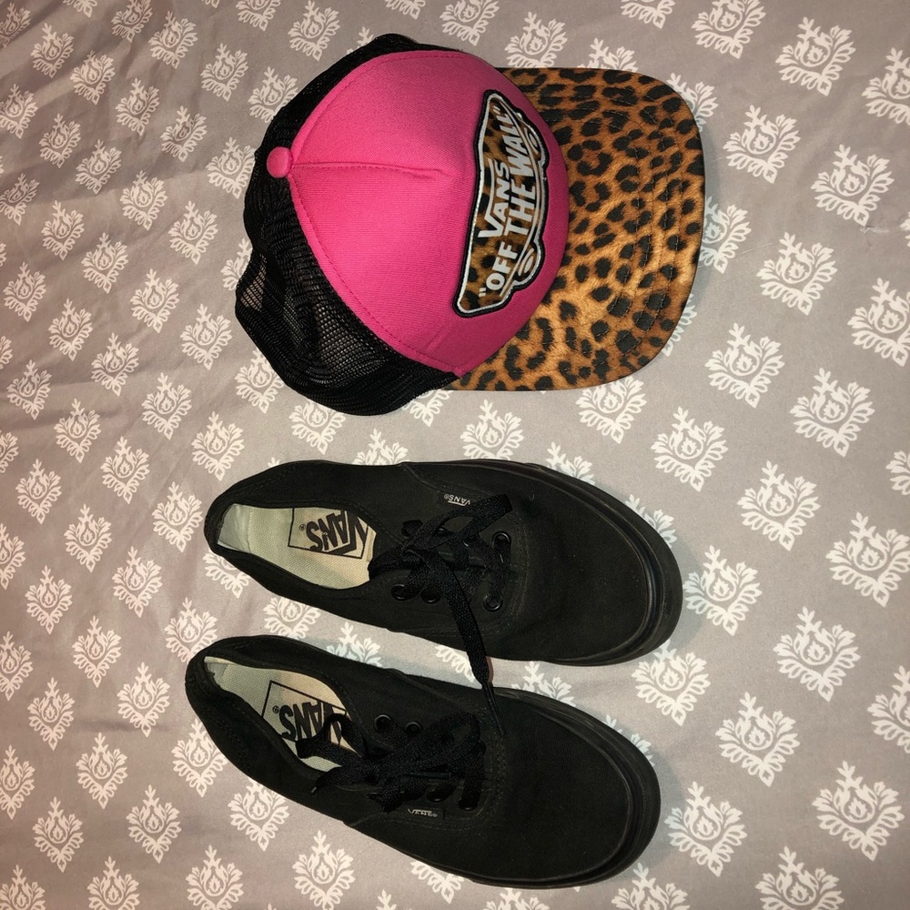 Black Vans sneakers and Vans hat